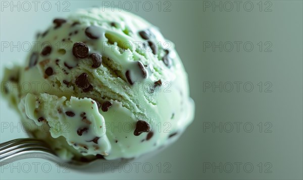 Mint chocolate chip ice cream scoop, closeup AI generated