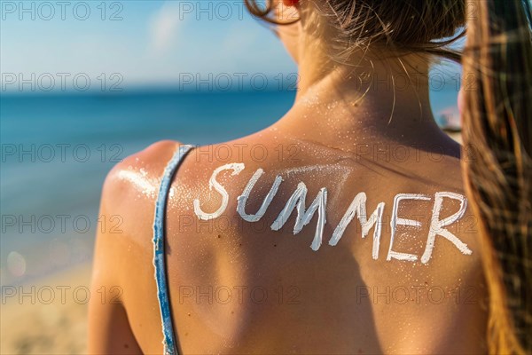 Back of woman at beach with text 'Summer ' written on skin with sunscreen cream. KI generiert, generiert, AI generated