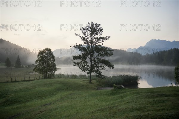 Sunrise and morning fog, Geroldsee or Wagenbruechsee, Kruen near Mittenwald, Werdenfelser Land, Upper Bavaria, Bavaria, Germany, Europe