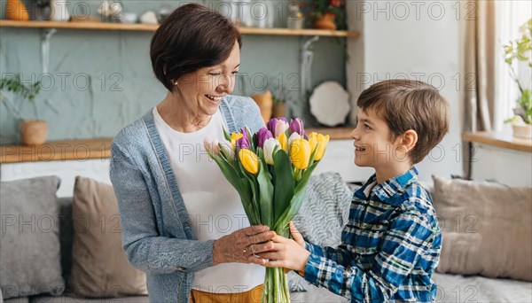 A boy hands a smiling older woman a colourful bouquet of tulips, symbol of Mother's Day, AI generated, AI generated