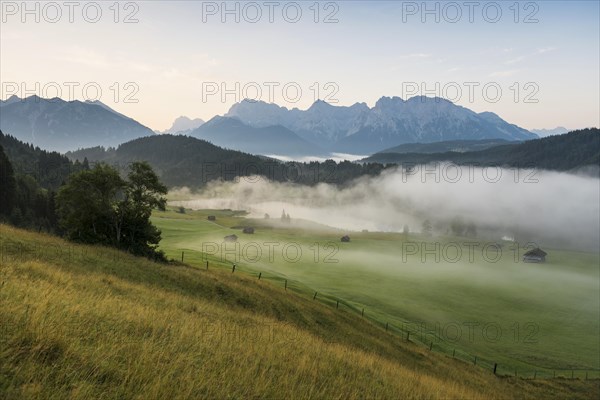 Sunrise and morning fog, Geroldsee or Wagenbruechsee, Kruen near Mittenwald, Werdenfelser Land, Upper Bavaria, Bavaria, Germany, Europe