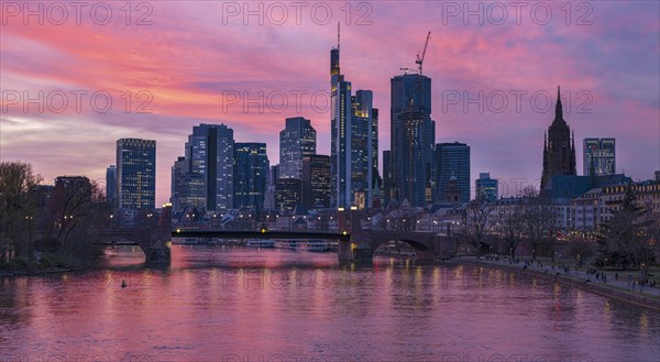 The Frankfurt skyline with office towers behind the Main at sunset, on the right the Kaiserdom, Frankfurt am Main, Hesse, Germany, Europe