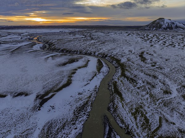 Overgrown river landscape, onset of winter, sunset, volcanic hills, Fjallabak Nature Reserve, drone shot, Sudurland, Iceland, Europe