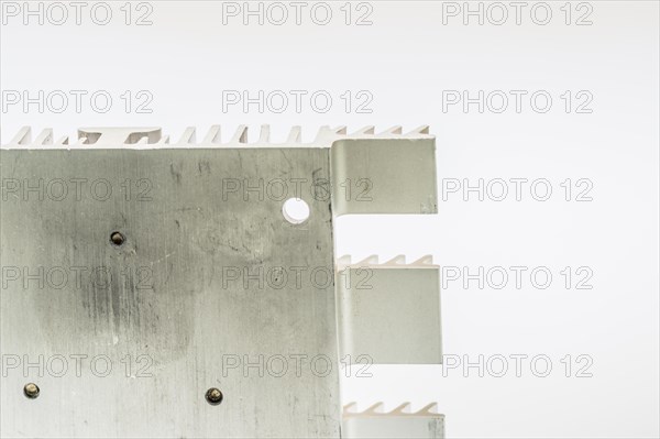 Closeup of mounting surface of rectangle aluminum heat sink on white background