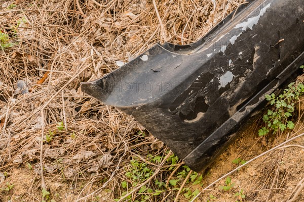 An old decaying tire discarded in a natural outdoor setting, in South Korea