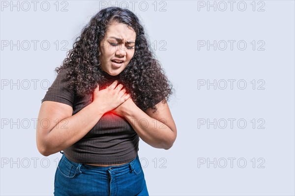 People with chest pain isolated. Young woman with tachycardia isolated. Latin girl with heart pain. Concept of people with heart problems