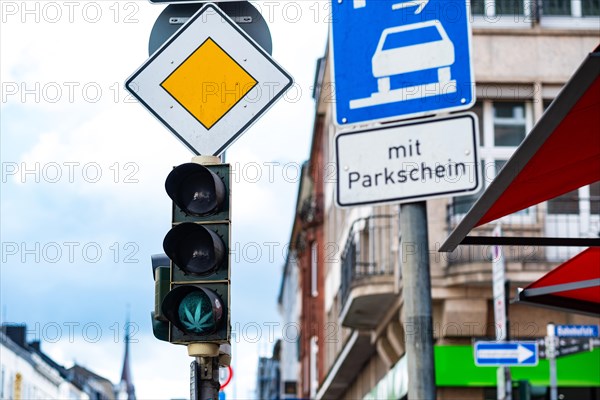 Traffic lights with cannabis leaf and right of way sign in Aachen, Germany, Europe