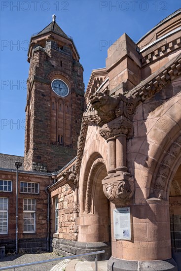 Historic Wilhelmine railway station, clock tower, pavilion with gargoyle, entrance to the station building, neo-Romanesque and Art Nouveau, red sandstone, cultural monument, listed building, Giessen, Giessen, Hesse, Germany, Europe