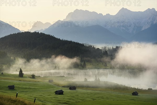 Sunrise and morning fog, Geroldsee or Wagenbruechsee, Kruen near Mittenwald, Werdenfelser Land, Upper Bavaria, Bavaria, Germany, Europe