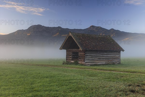 Small wooden hut, morning mood over mountains, fog, spring, Loisach-Lake Kochel-Moor, Bavaria, Germany, Europe