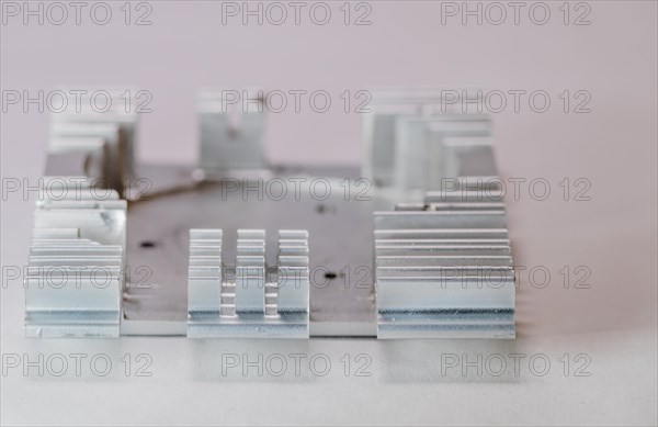 Closeup of fins of rectangle aluminum heat sink on white background