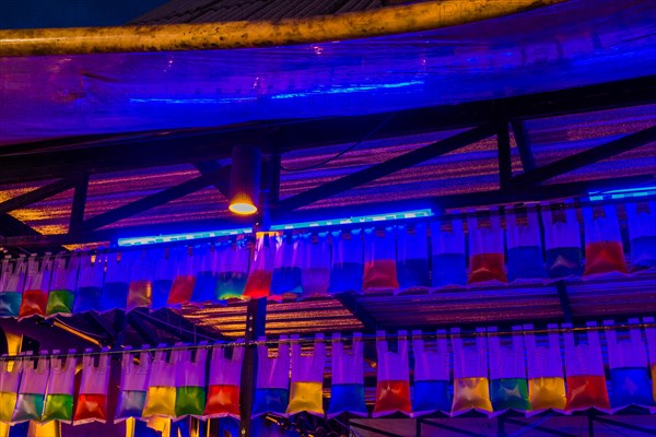 Vibrant neon lights illuminate an empty theater at night, in Chiang Mai, Thailand, Asia