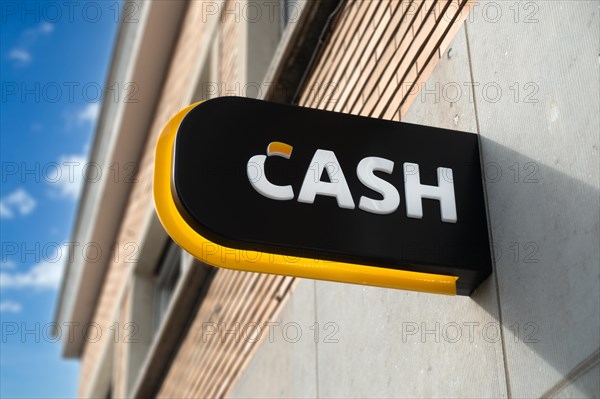 Sign showing logo of ATM cash dispenser of bank neutral Bancontact CASH point in Flanders, Belgium, Europe