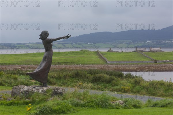 A shot of Niall Bruton's outstanding statue, Waiting on the Shore, depicting a woman with arms outstretched in recognition of those who sailed the seas off the West coast and the women who waited at home for their safe return. Rosses Point, Sligo, Ireland, Europe
