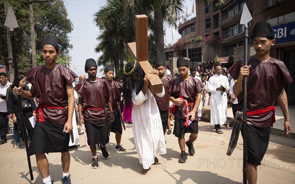 Christian devotees takes part in a perform to re-enactment of the crucifixion of Jesus Christ during a procession on Good Friday, on March 29, 2024 in Guwahati, Assam, India. Good Friday is a Christian holiday commemorating the crucifixion of Jesus Christ and his death at Calvary