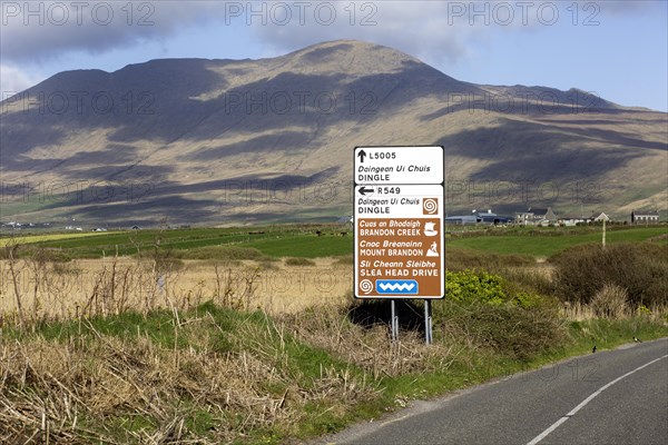 An Irish language road sign in the heart of the Kerry Gaeltacht or Irish-speaking area showing the way to Dingle and Mount Brandon