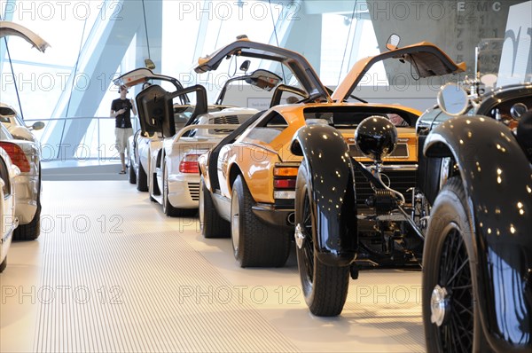 Museum, Mercedes-Benz Museum, Stuttgart, row of Mercedes-Benz sports cars and classic cars with gullwing doors in a showroom, Mercedes-Benz Museum, Stuttgart, Baden-Wuerttemberg, Germany, Europe