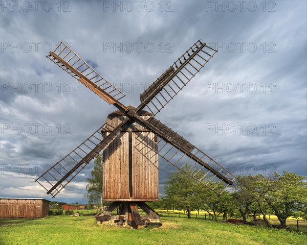 Windmill in front of a stormy sky, windmill, trestle windmill, Sargstedt, Saxony-Anhalt, Germany, Europe