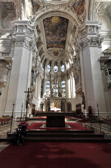 St Stephen's Cathedral, Passau, Church interior with view of the altar, permeated by rays of light and baroque grandeur, Passau, Bavaria, Germany, Europe