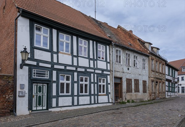 Partly dilapidated houses in Muehlenstrasse, Havelberg, Saxony-Anhalt, Germany, Europe