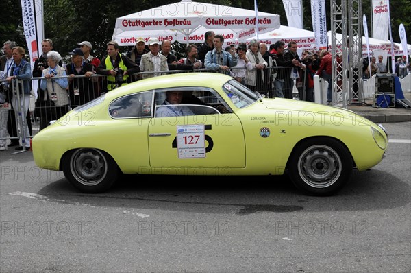 A yellow classic racing car with starting number 127 drives past spectators, SOLITUDE REVIVAL 2011, Stuttgart, Baden-Wuerttemberg, Germany, Europe