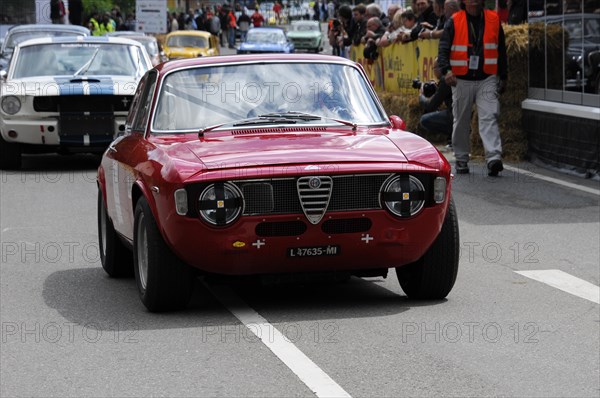 A red Alfa Romeo as a racing car on a track surrounded by spectators, SOLITUDE REVIVAL 2011, Stuttgart, Baden-Wuerttemberg, Germany, Europe