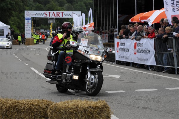 Police motorbike passing the starting line of an event, audience in the background, SOLITUDE REVIVAL 2011, Stuttgart, Baden-Wuerttemberg, Germany, Europe