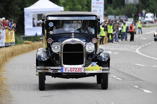 Ford Model A, year of construction 1929, A black Ford Cabriolet vintage car drives in a race with spectators in the background, SOLITUDE REVIVAL 2011, Stuttgart, Baden-Wuerttemberg, Germany, Europe