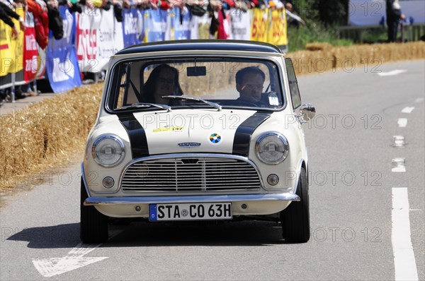 A white Mini Cooper takes part in a classic car race, SOLITUDE REVIVAL 2011, Stuttgart, Baden-Wuerttemberg, Germany, Europe