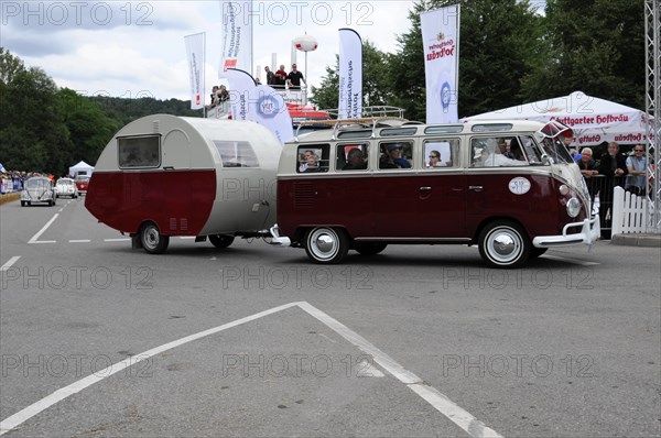 A classic red VW bus with attached caravan at an event, SOLITUDE REVIVAL 2011, Stuttgart, Baden-Wuerttemberg, Germany, Europe