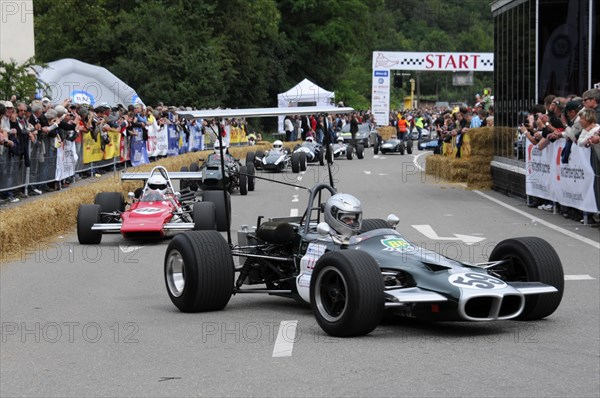 Various formula racing cars at the starting line of a motorsport event with spectators in the background, SOLITUDE REVIVAL 2011, Stuttgart, Baden-Wuerttemberg, Germany, Europe