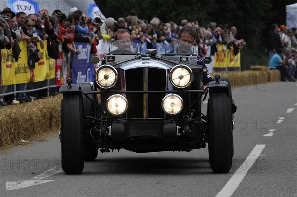 Historic racing car drives past the public at night with its headlights switched on, SOLITUDE REVIVAL 2011, Stuttgart, Baden-Wuerttemberg, Germany, Europe