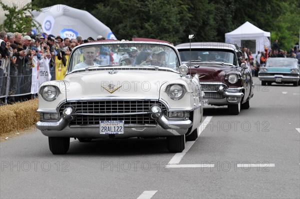 Two Cadillacs, one white and one dark red, at a classic car race, SOLITUDE REVIVAL 2011, Stuttgart, Baden-Wuerttemberg, Germany, Europe