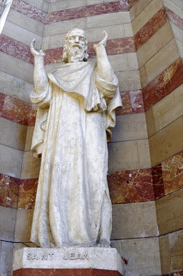 Marseille Cathedral or Cathedrale Sainte-Marie-Majeure de Marseille, 1852-1896, Marseille, Statue of Saint Jean, depicted with outstretched arms in front of a stone column, Marseille, Departement Bouches-du-Rhone, Region Provence-Alpes-Cote d'Azur, France, Europe