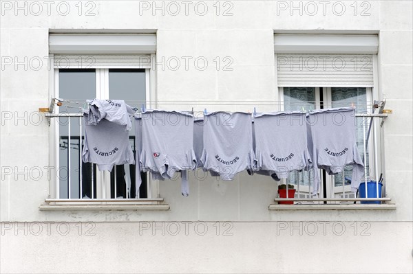 Marseille, Blue T-shirts on a washing line outside the window, Marseille, Departement Bouches-du-Rhone, Region Provence-Alpes-Cote d'Azur, France, Europe