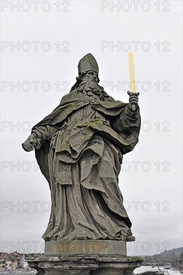 Statue of Saint Kilian on the old Main bridge, statue of a bishop or saint with a sword, on a pedestal, Wuerzburg, Lower Franconia, Bavaria, Germany, Europe