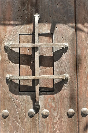 Solabrena, Traditional heavy lock on a rustic wooden door, Andalusia, Spain, Europe