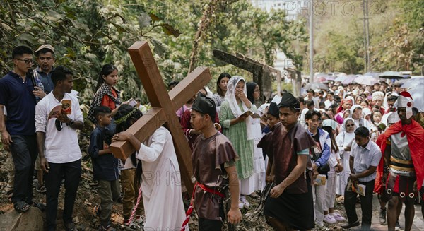 Christian devotees takes part in a perform to re-enactment of the crucifixion of Jesus Christ during a procession on Good Friday, on March 29, 2024 in Guwahati, Assam, India. Good Friday is a Christian holiday commemorating the crucifixion of Jesus Christ and his death at Calvary