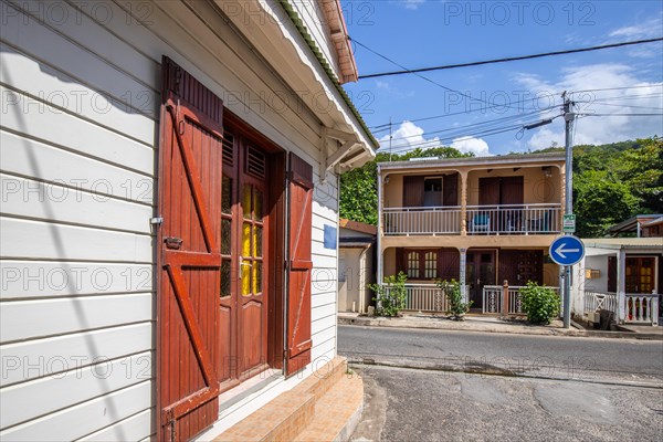 Deshaies, historic Caribbean wooden building of a street in Guadeloupe, Caribbean, French Antilles