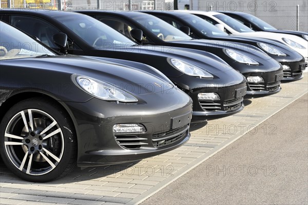A row of black Porsche cars parked in a car park, Schwaebisch Gmuend, Baden-Wuerttemberg, Germany, Europe