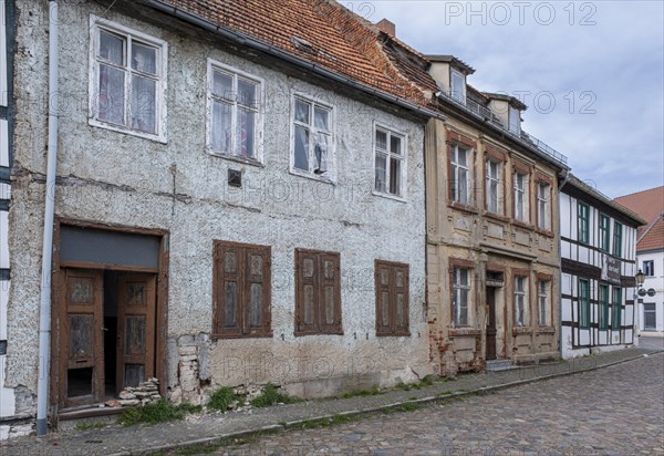 Partly dilapidated houses in Muehlenstrasse, Havelberg, Saxony-Anhalt, Germany, Europe