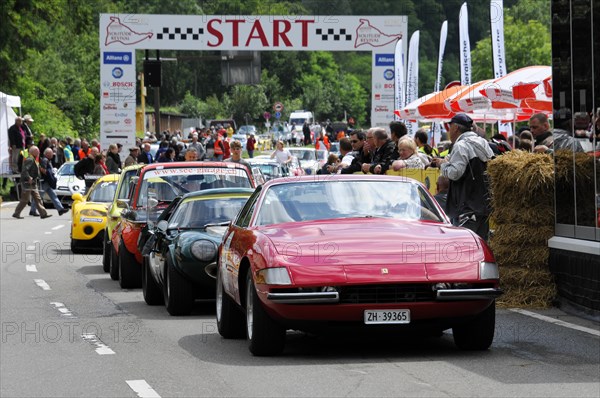 A red sports car at the classic car race prepares at the starting line, surrounded by spectators, SOLITUDE REVIVAL 2011, Stuttgart, Baden-Wuerttemberg, Germany, Europe