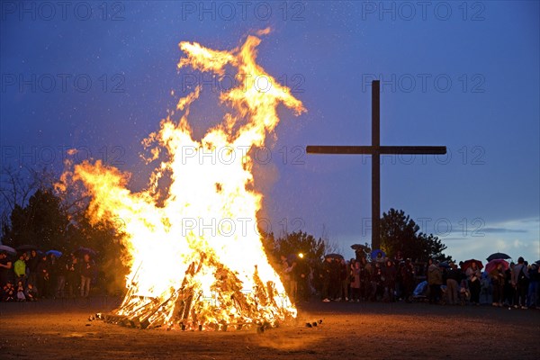 Easter bonfire on the Haniel spoil tip in front of the summit cross, Bottrop, Ruhr area, North Rhine-Westphalia, Germany, Europe