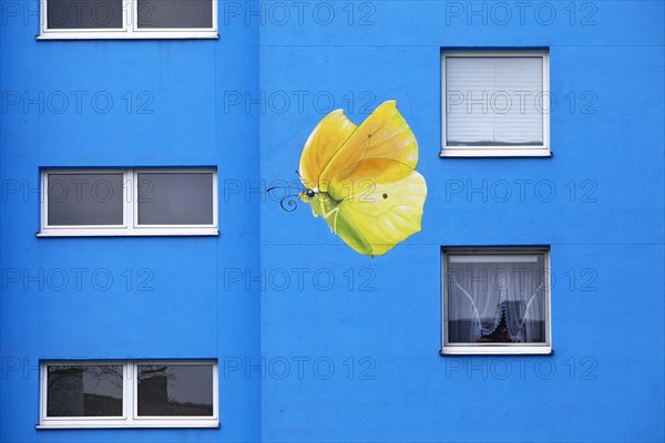 Sunflower house, painted yellow lemon butterfly on a skyscraper, artist Ulrich Allgaier, Wuppertal, North Rhine-Westphalia, Germany, Europe