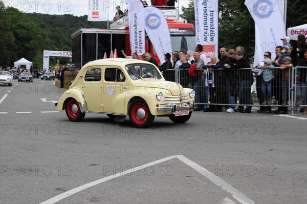 A small yellow and red vintage car takes part in a historic car race, SOLITUDE REVIVAL 2011, Stuttgart, Baden-Wuerttemberg, Germany, Europe