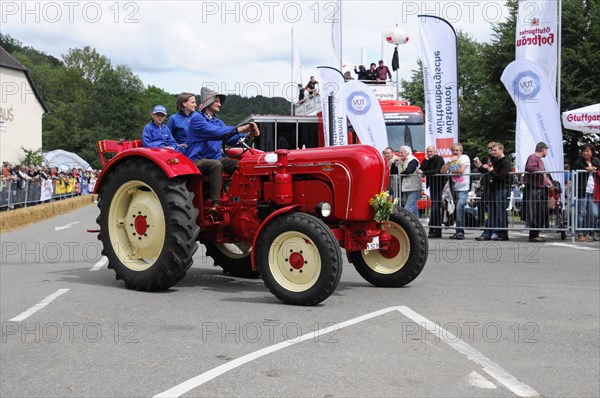 Porsche Diesel Tractors, A historic red tractor is proudly driven in a summer parade, SOLITUDE REVIVAL 2011, Stuttgart, Baden-Wuerttemberg, Germany, Europe