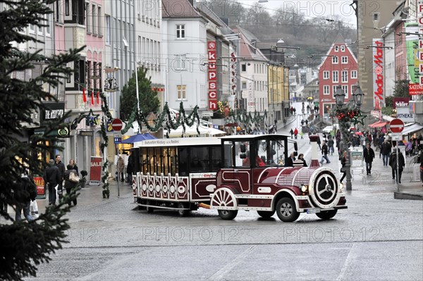 Wuerzburg, tourist train travelling through the pedestrian zone of a European city with Christmas decorations, Wuerzburg, Lower Franconia, Bavaria, Germany, Europe