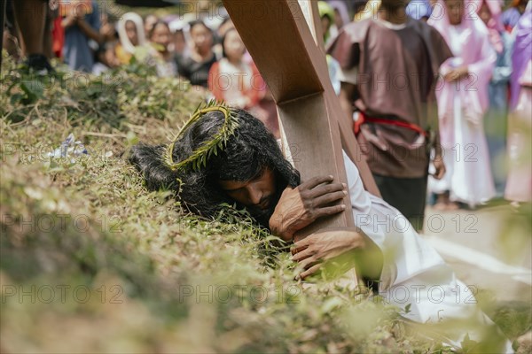 Christian devotees takes part in a perform to re-enactment of the crucifixion of Jesus Christ during a procession on Good Friday, on March 29, 2024 in Guwahati, Assam, India. Good Friday is a Christian holiday commemorating the crucifixion of Jesus Christ and his death at Calvary