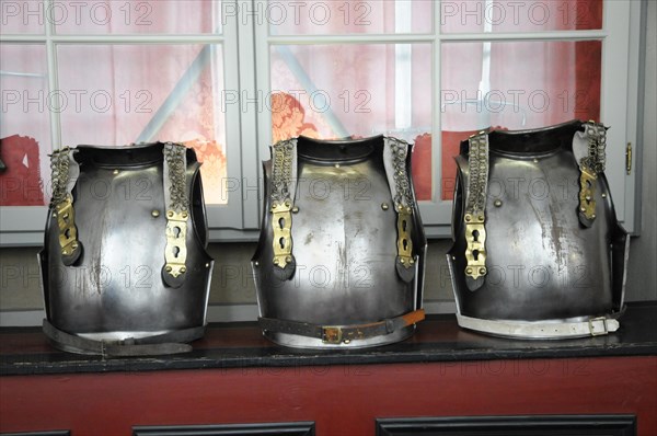 Langenburg Castle, Three metal armours lined up in front of a window, Langenburg Castle, Langenburg, Baden-Wuerttemberg, Germany, Europe