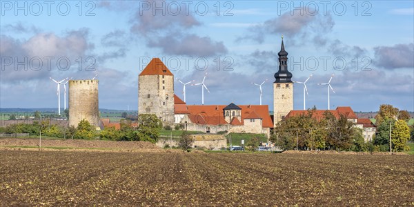 View over a harvested field to Querfurt Castle in autumn, Querfurt, Saxony-Anhalt, Germany, Europe